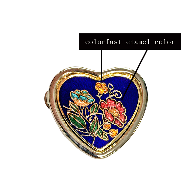 small heart-shaped enamel pill box